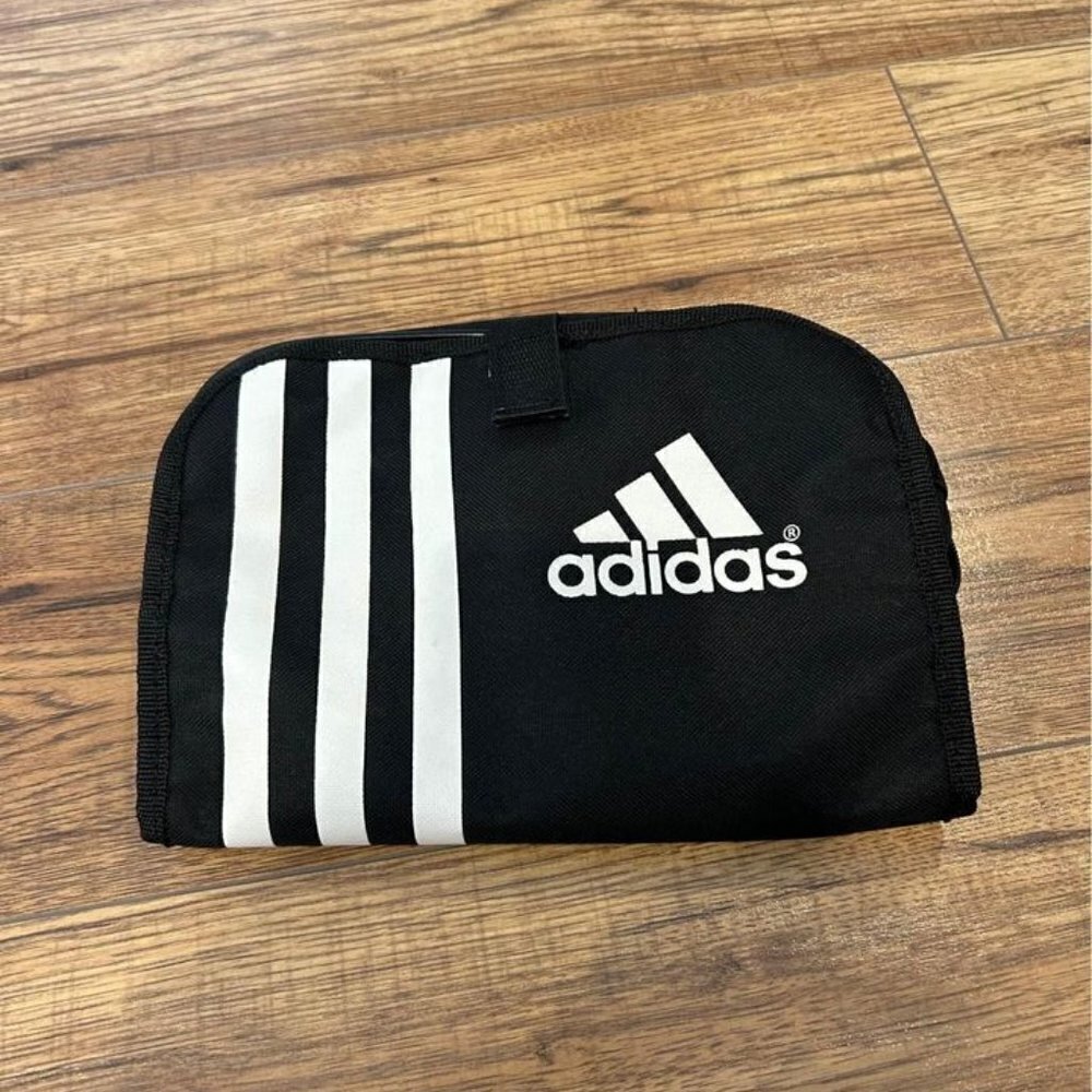 Adidas toiletry travel bag. Hook for hanging, multiple compartments. New conditi